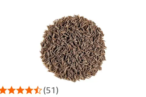 En hög med bruna, avlånga spiskumminfrön (cumin seeds svenska).