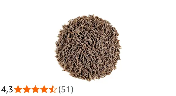 En hög med bruna, avlånga spiskumminfrön (cumin seeds svenska).