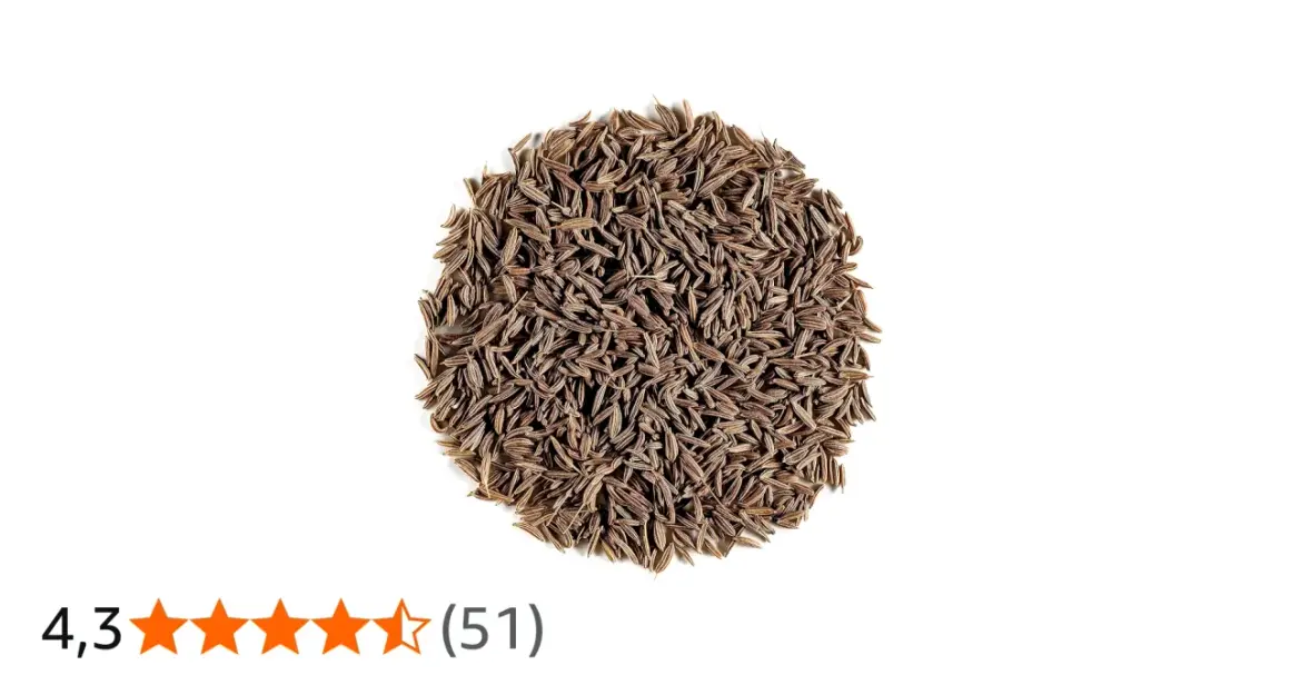 En hög med bruna, avlånga spiskumminfrön (cumin seeds svenska).